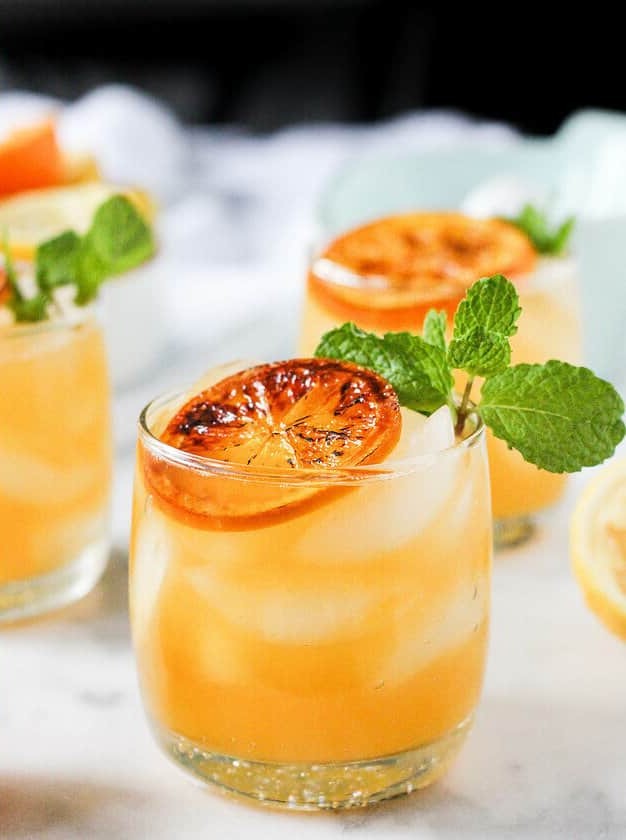 Boozy Clementine Lemonade With Brûléed Citrus & Mint